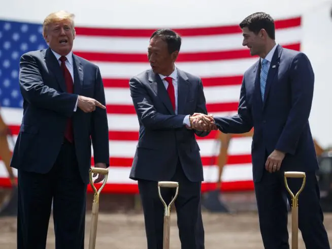 President Donald Trump participates in a Foxconn groundbreaking cermony, Thursday, June 28, 2018, in Mt. Pleasant, Wis. From left, Trump, Foxconn Chairman Terry Gou, and Speaker of the House Rep. Paul Ryan, R-Wis. (AP Photo/Evan Vucci)
