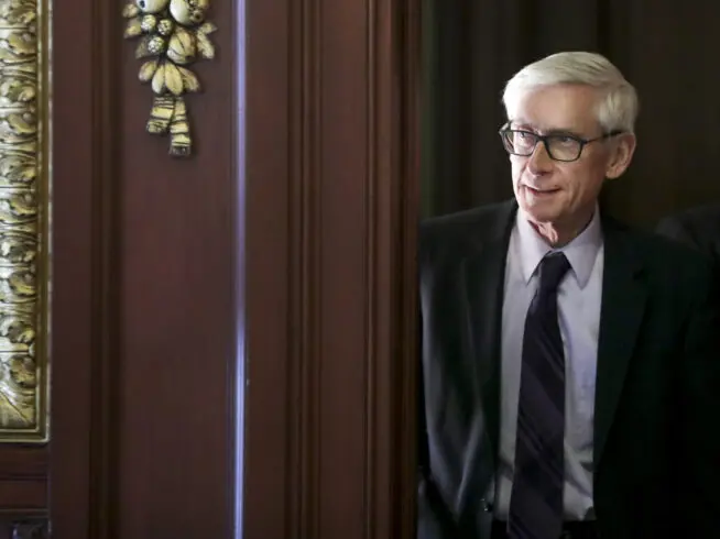 Governor Tony Evers arrives to a ceremony at the State Capitol in Madison, WI.
