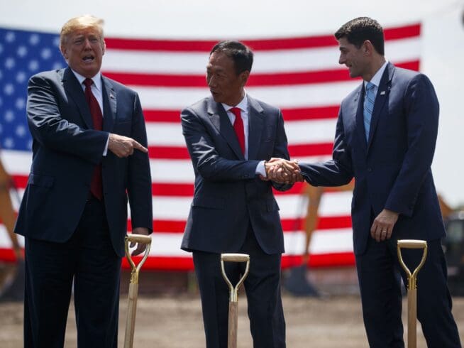 President Donald Trump participates in a Foxconn groundbreaking cermony, Thursday, June 28, 2018, in Mt. Pleasant, Wis. From left, Trump, Foxconn Chairman Terry Gou, and Speaker of the House Rep. Paul Ryan, R-Wis. (AP Photo/Evan Vucci)
