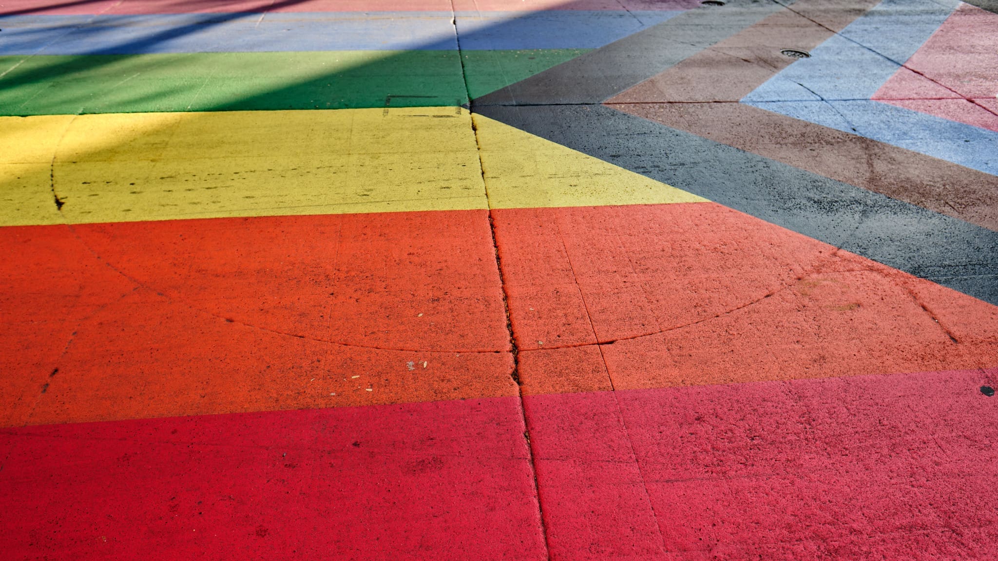 Progress Pride flag on a crosswalk in Madison, W.I.