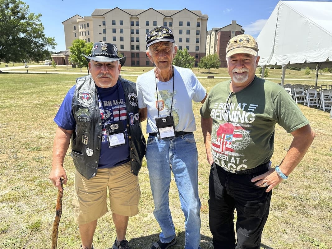 Vincent Ochoa, left, Patrick McGuire, center, and Mark Melancon, right, all veterans of the U.S. Army's 82nd Airborne Division, pose for a photograph following the All American Hall of Fame Induction Ceremony at the military base then called Fort Bragg, on Wednesday, May 24, 2023, in Fort Liberty, N.C. (AP Photo/Michelle R. Smith)