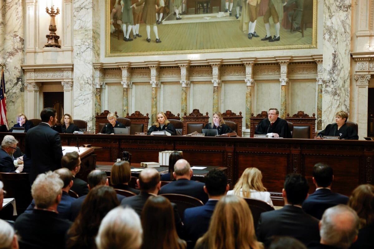 The Wisconsin Supreme Court listens to arguments from Wisconsin Assistant Attorney General Anthony D. Russomanno, representing Gov. Tony Evers, during a redistricting hearing at the state Capitol, Nov. 21, 2023, in Madison, W.I.