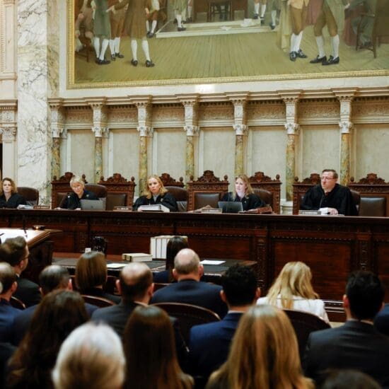 The Wisconsin Supreme Court listens to arguments from Wisconsin Assistant Attorney General Anthony D. Russomanno, representing Gov. Tony Evers, during a redistricting hearing at the state Capitol, Nov. 21, 2023, in Madison, W.I.